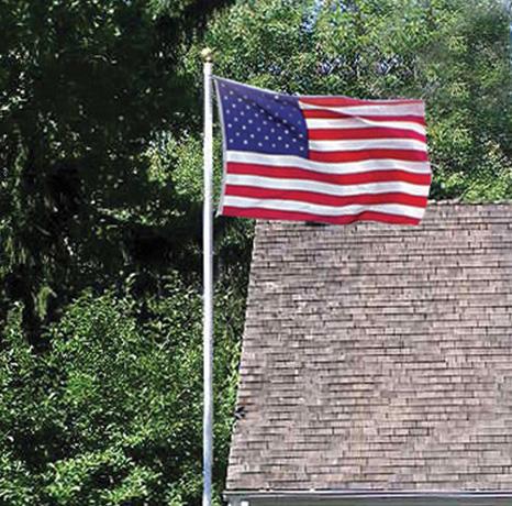 American flag flying near house