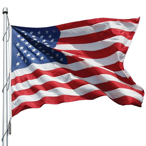 Nylon American Flag - Beacon® waving on a flagpole, showing vibrant red, white, and blue colors with stars and stripes in motion.