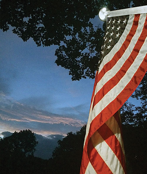 American flag against twilight sky