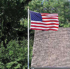 American flag flying near house
