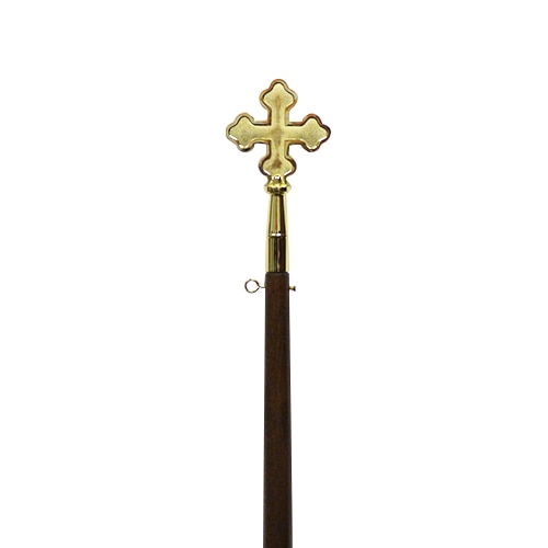 golden cross on wooden staff