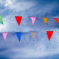 colorful flags against blue sky
