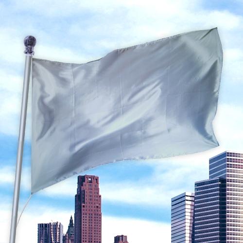 White solid flag made of durable nylon fabric waving on a flagpole against a city skyline, Solid Colored Flags - Premier Nylon.