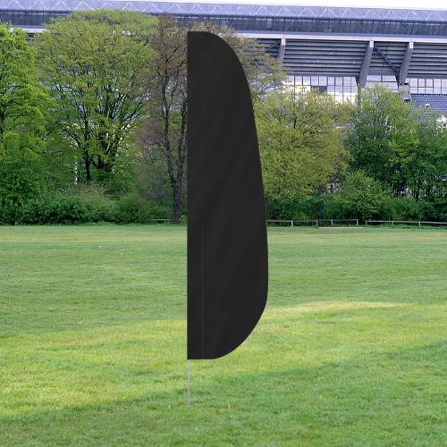 Black Solid Color Feather Flags standing upright on a grassy field with trees and a stadium in the background.