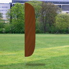 Solid Color Flutter Flags displayed outdoors with a solid brown fabric design standing on a grassy field near trees and buildings.