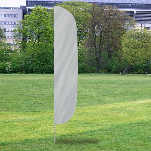Solid Color Flutter Flags in light silver standing upright on a grassy field with trees and buildings in the background.