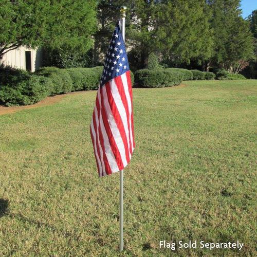 American flag on pole in lawn