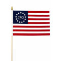 250 Betsy Ross Stick Flag featuring 13 red and white stripes with a blue canton containing 13 stars in a circle and the number 250 at the center.