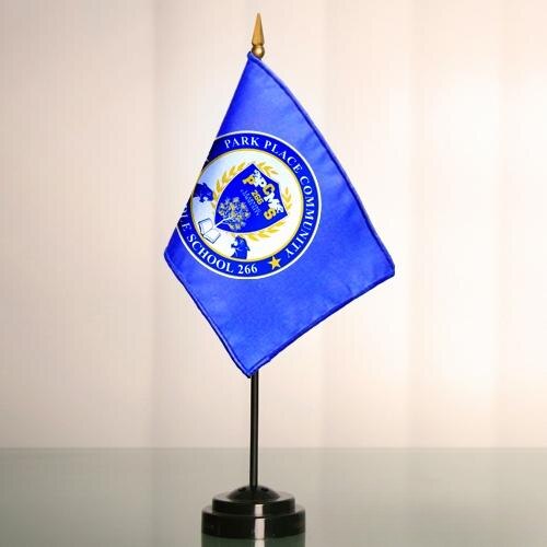 4" X 6" Custom Nylon Mini Flags (Minimum 125) featuring a blue flag with a detailed school emblem on a black tabletop stand.