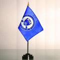 4" X 6" Custom Nylon Mini Flags (Minimum 125) featuring a blue flag with a detailed school emblem on a black tabletop stand.