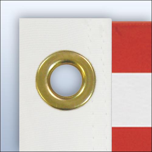 gold grommet on white fabric