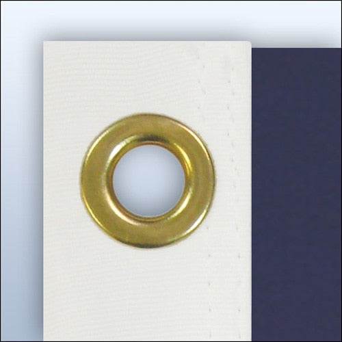 gold grommet on white fabric