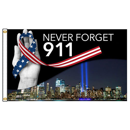 Never Forget 9/11 Flag featuring a hand holding a patriotic ribbon, white text, and Twin Towers Tribute lights over the New York City skyline at night.