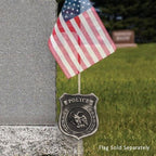 police badge next to flag