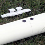 white pulley on white pipe grass