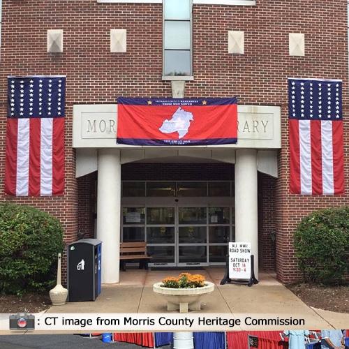 Morris Library with flags and banne