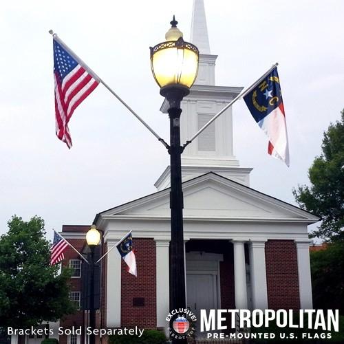 Lamp post with flags and church bac
