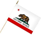 California Republic stick flag with bear, red star, and red stripe on white background
