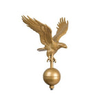 gold eagle ornament on sphere