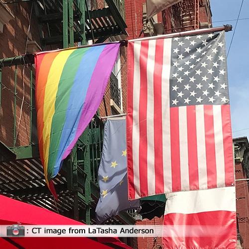 rainbow flag and US flag displayed