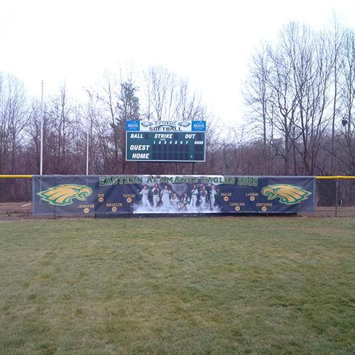 scoreboard and banner at softball f