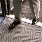 man in suit standing at doorway